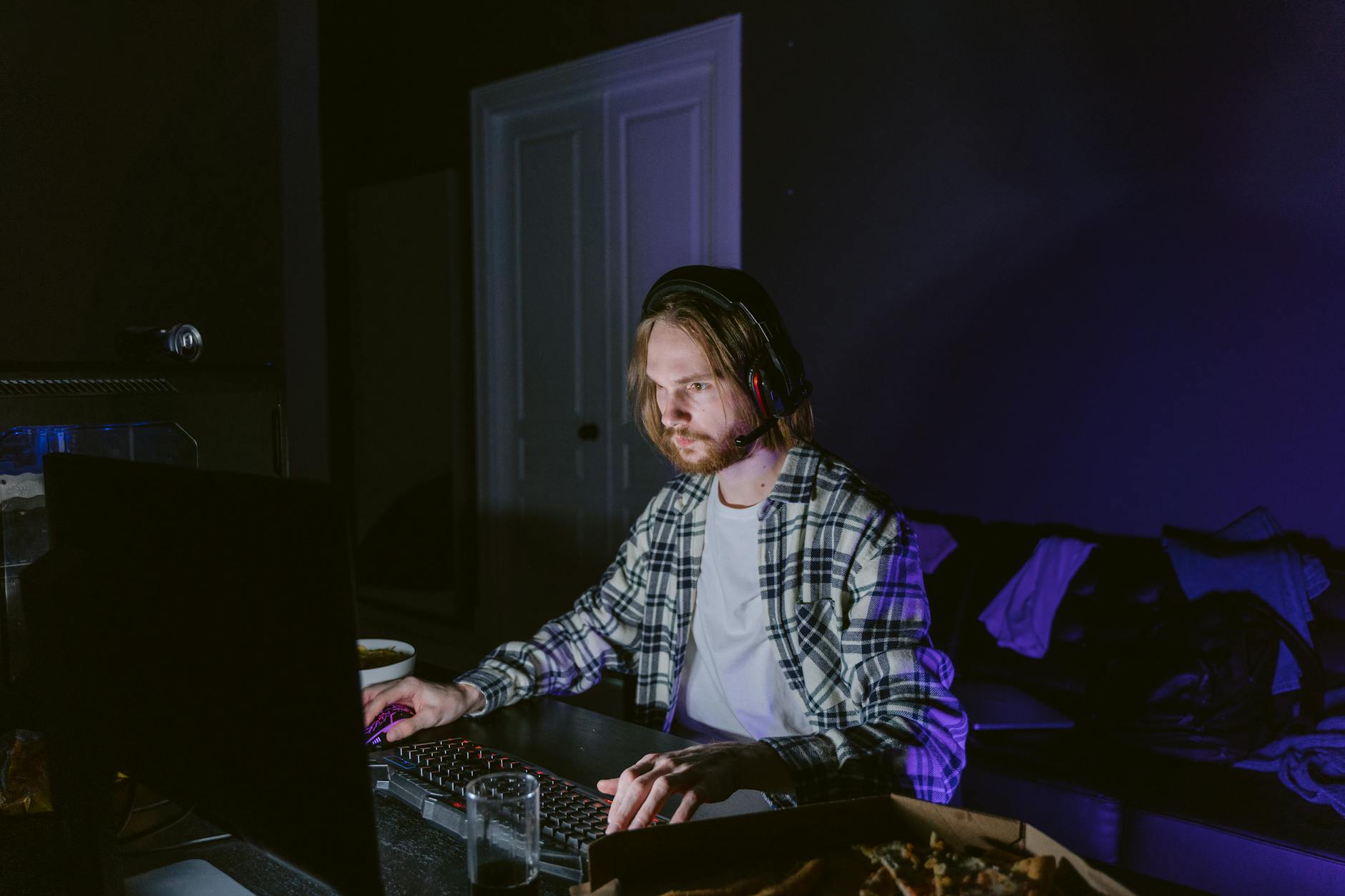 An indie game developer working at a computer.